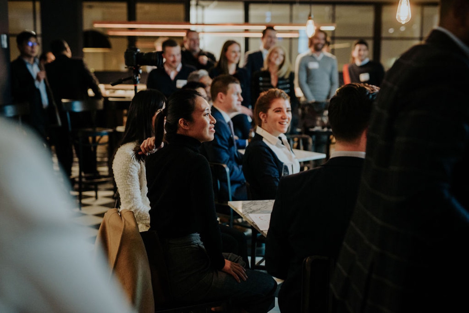 Founders listening at an Iridium Private event